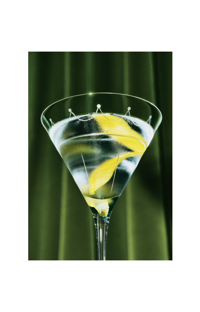 A close up view of a Martini with a twist of lemon, viewed from below.